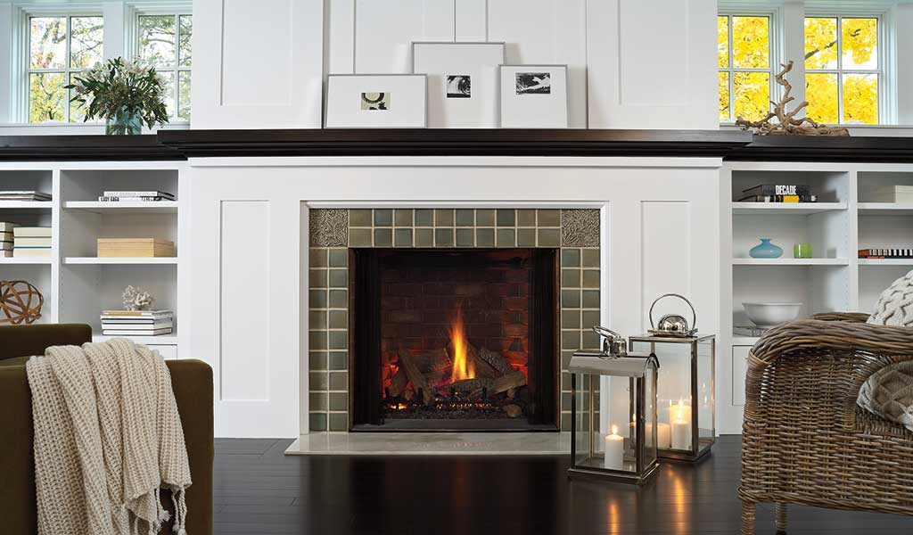 rich hardwood floors add to the cozy atmosphere of this sitting area with fireplace