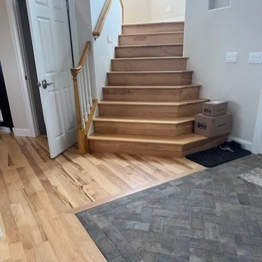Hardwood flooring in Fort Collins entryway with tile 